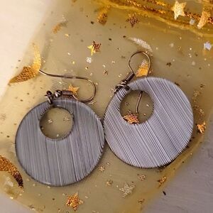 Super cute silver colored dangle boho light earrings